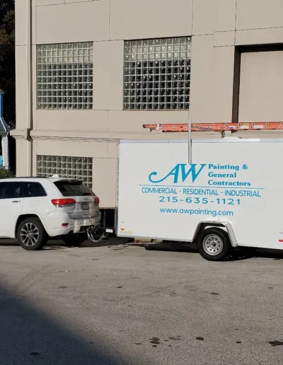 AW Painting & General Contractors, Inc. trailer hooked up to a Jeep.